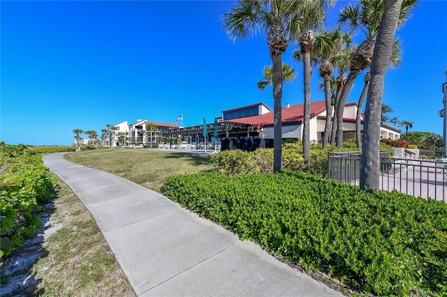 view of property's community featuring a yard