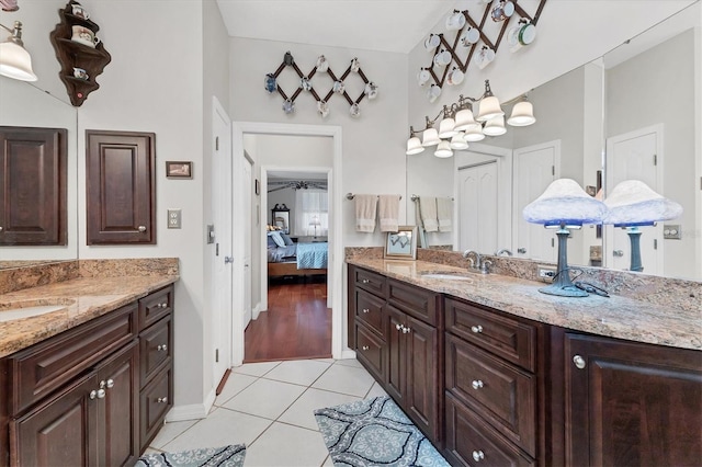 bathroom featuring tile patterned flooring and vanity