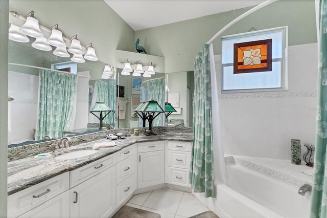 bathroom featuring tile patterned floors, shower / tub combo with curtain, and vanity