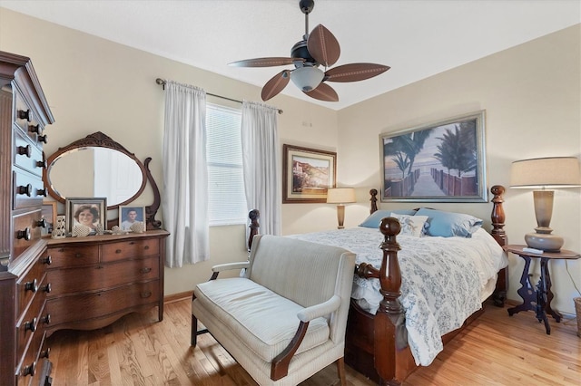 bedroom with light hardwood / wood-style floors and ceiling fan