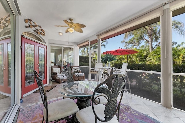 sunroom with ceiling fan and french doors