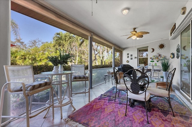 sunroom / solarium with ceiling fan