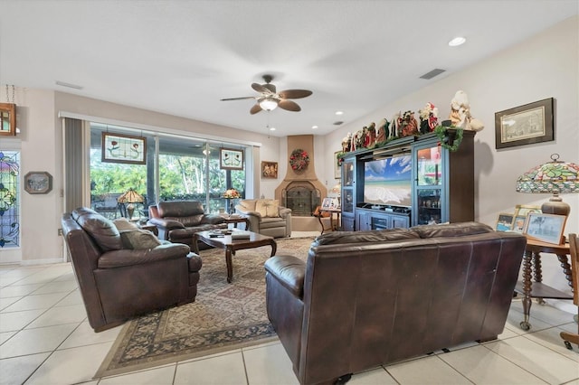 living room featuring light tile patterned floors and ceiling fan