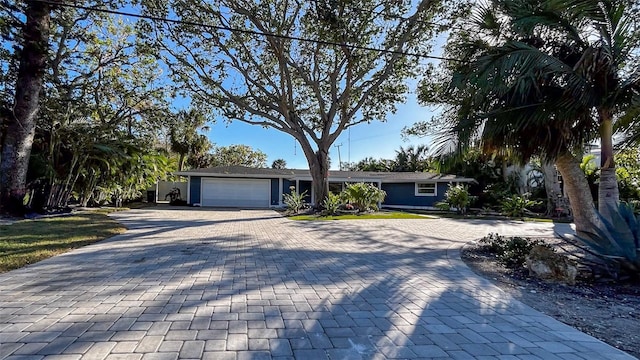 ranch-style home featuring a garage