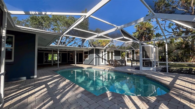 view of pool featuring a patio and glass enclosure