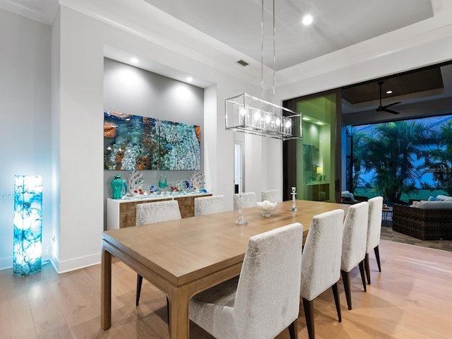 dining space featuring ceiling fan and light hardwood / wood-style flooring