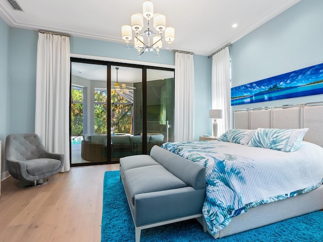 bedroom with access to outside, a chandelier, wood-type flooring, and ornamental molding