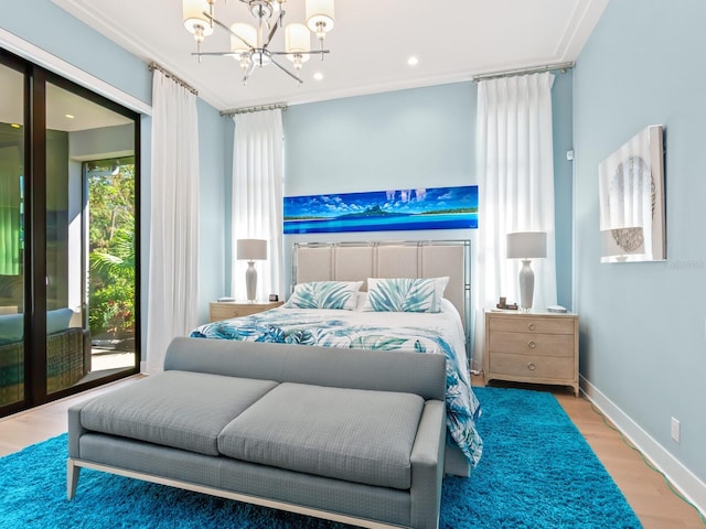 bedroom featuring hardwood / wood-style floors, an inviting chandelier, and crown molding