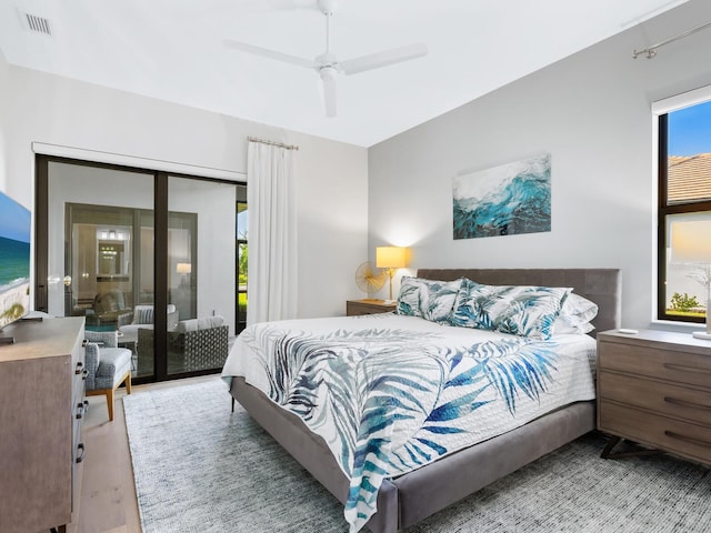 bedroom with ceiling fan, a closet, and light hardwood / wood-style flooring