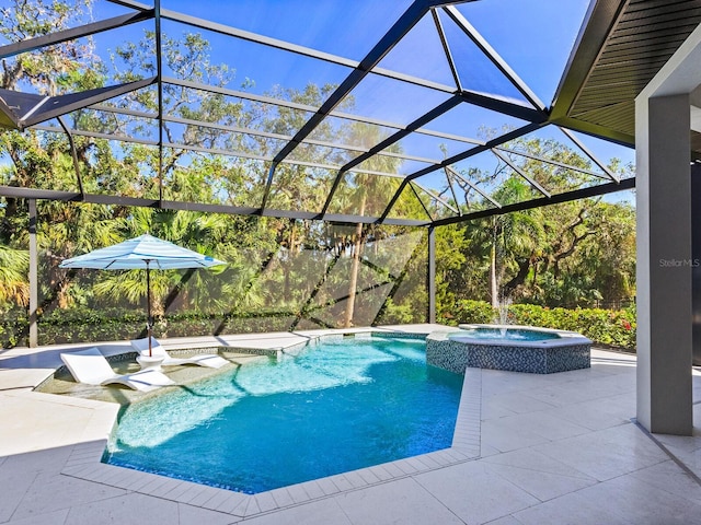 view of pool with a lanai, an in ground hot tub, and a patio