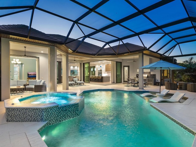 pool at dusk with an outdoor living space, pool water feature, glass enclosure, and ceiling fan