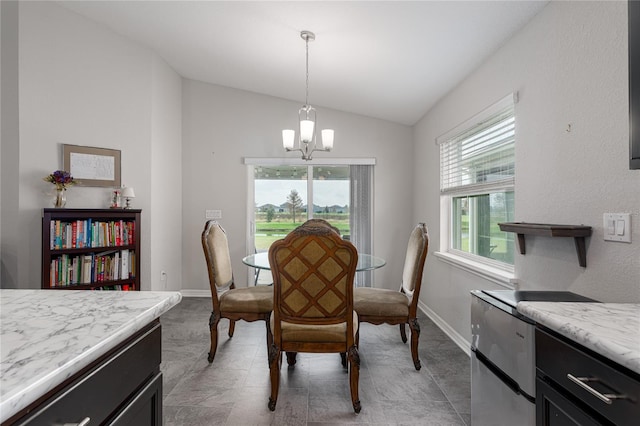 dining room featuring lofted ceiling and a notable chandelier