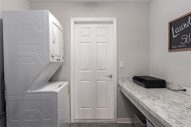 washroom with stacked washer / dryer