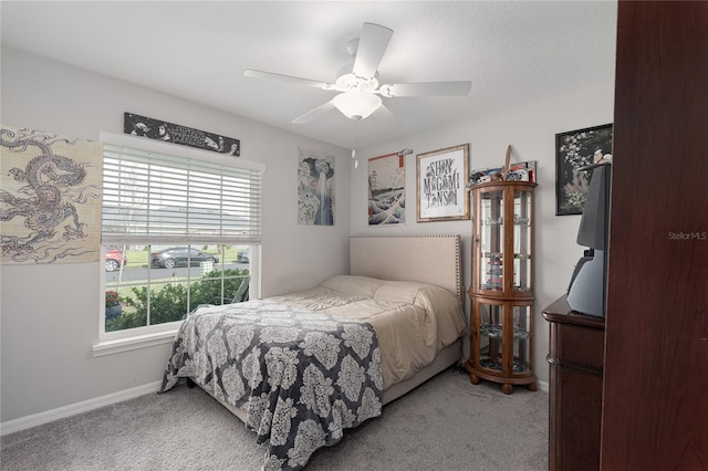 bedroom featuring ceiling fan and light colored carpet