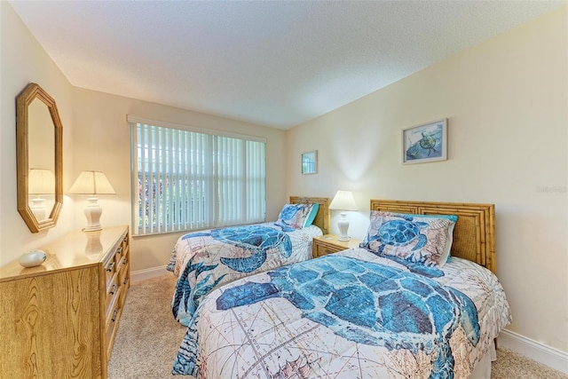 carpeted bedroom with a textured ceiling