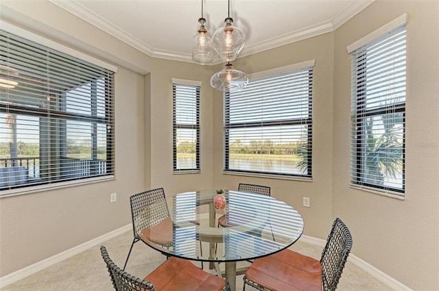 dining room featuring light tile patterned floors and ornamental molding