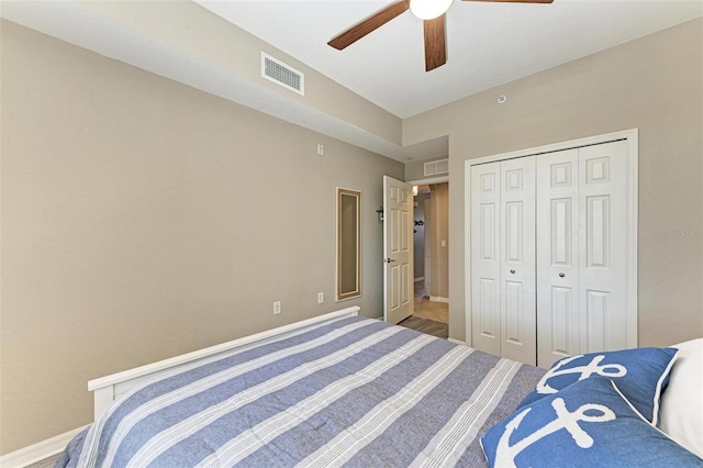 bedroom with ceiling fan and a closet