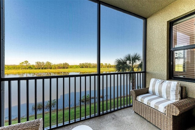 sunroom with a water view