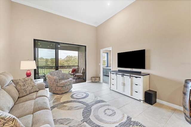 tiled living room featuring crown molding and a high ceiling