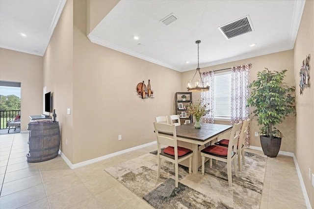 dining room featuring ornamental molding, light tile patterned floors, and a chandelier