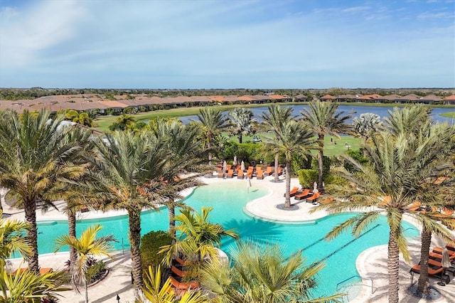 view of swimming pool featuring a water view