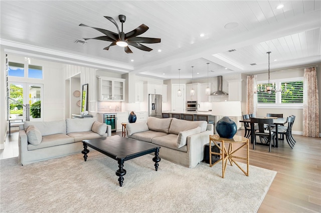 931 Bayshore Rd, Nokomis, FL 34275 - living room featuring wood ceiling with exposed beams, light wood-style flooring, ceiling fan, recessed lighting, and wine cooler