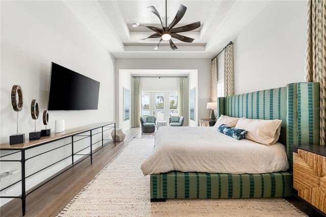 931 Bayshore Rd, Nokomis, FL 34275 - bedroom featuring a tray ceiling and wood finished floors