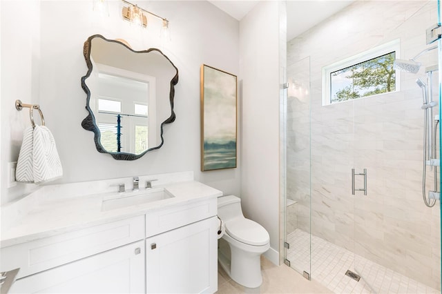 bathroom featuring toilet, vanity, tile patterned floors, and walk in shower