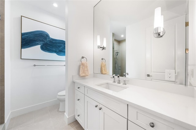 bathroom with tile patterned floors, vanity, toilet, and a shower with shower door