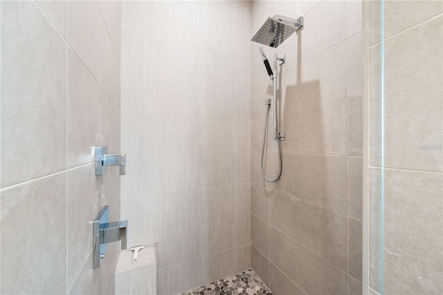 bathroom with tiled shower