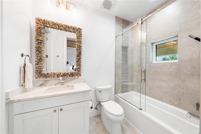 full bathroom featuring tile patterned floors, vanity, toilet, and combined bath / shower with glass door