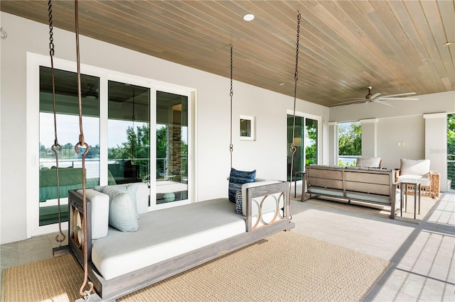 view of patio with outdoor lounge area and ceiling fan