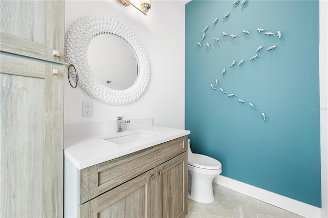 931 Bayshore Rd, Nokomis, FL 34275 - bathroom featuring vanity, toilet, tile patterned floors, and baseboards