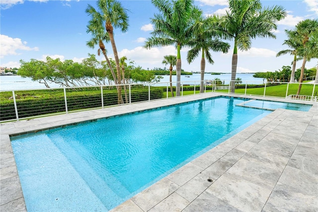 view of swimming pool featuring a water view