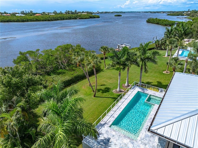 931 Bayshore Rd, Nokomis, FL 34275 - view of pool featuring a water view, a yard, and a pool with connected hot tub