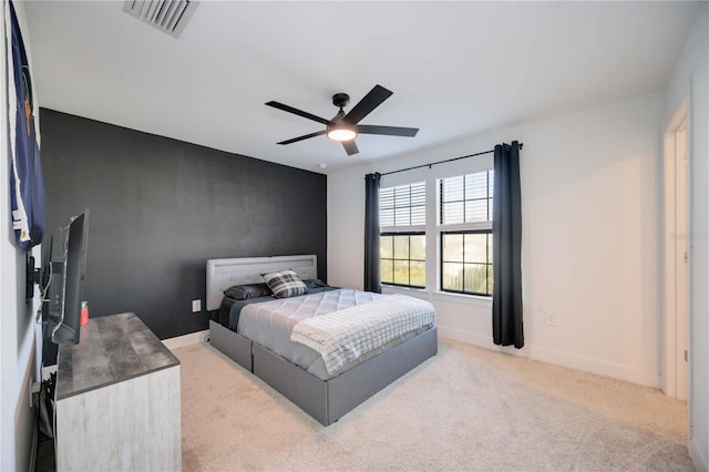 bedroom featuring ceiling fan and carpet