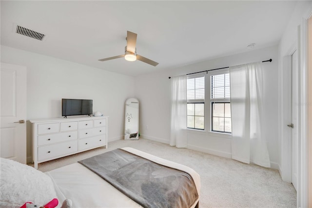 bedroom featuring ceiling fan and light colored carpet