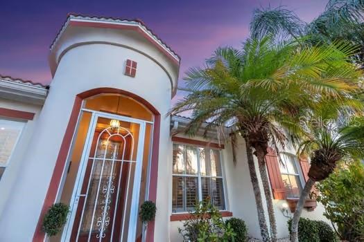 view of exterior entry at dusk