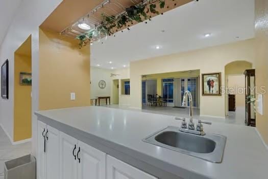 kitchen with white cabinetry and sink