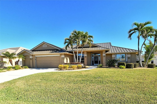 ranch-style house featuring a garage and a front yard