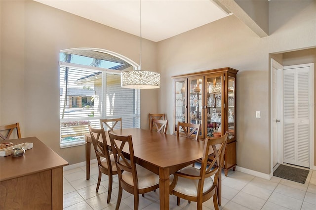 dining area featuring light tile patterned floors