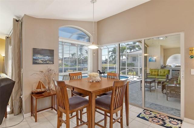 dining space featuring light tile patterned floors