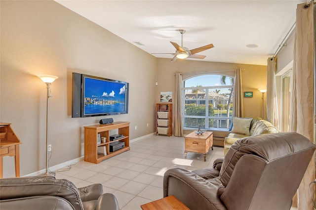 tiled living room with ceiling fan