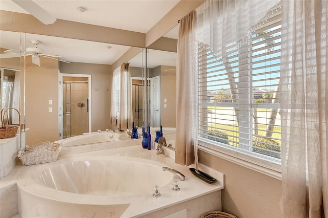 bathroom featuring shower with separate bathtub