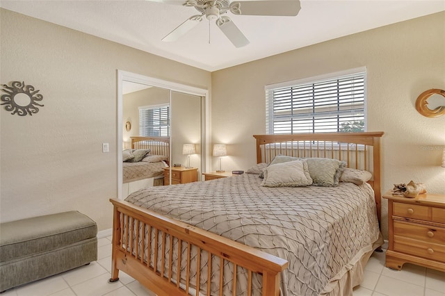 bedroom featuring ceiling fan and light tile patterned flooring