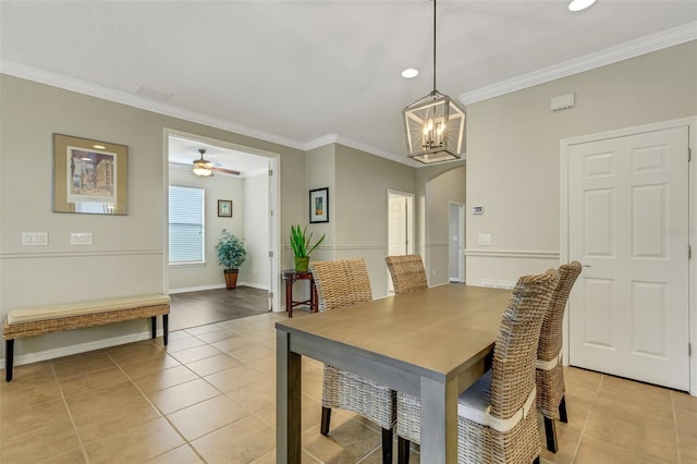 dining area featuring light tile patterned floors, ceiling fan, and ornamental molding