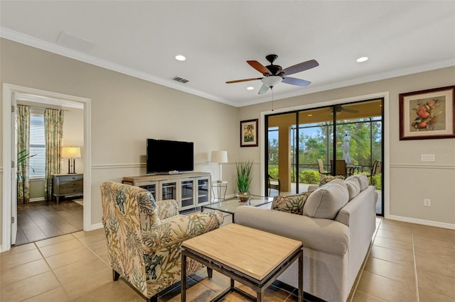 tiled living room featuring crown molding, plenty of natural light, and ceiling fan