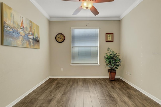 spare room featuring crown molding, ceiling fan, and dark wood-type flooring