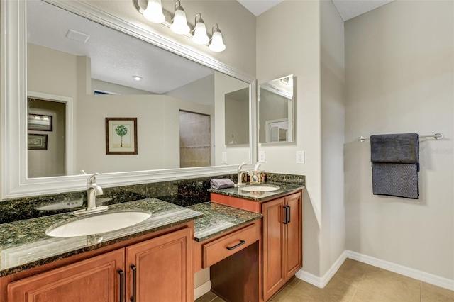 bathroom with tile patterned flooring, vanity, and vaulted ceiling