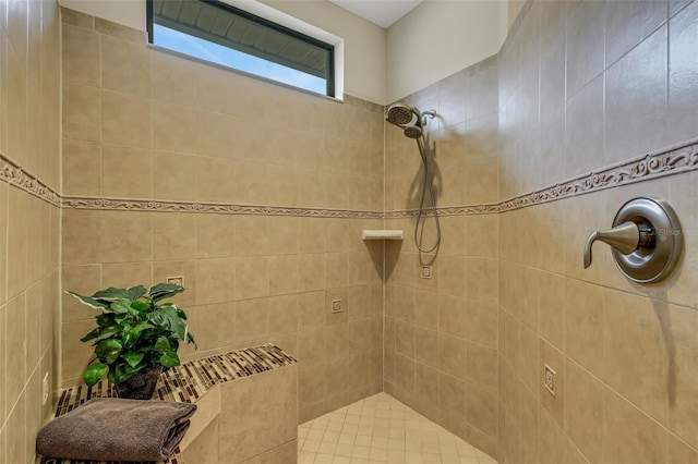 bathroom featuring a tile shower